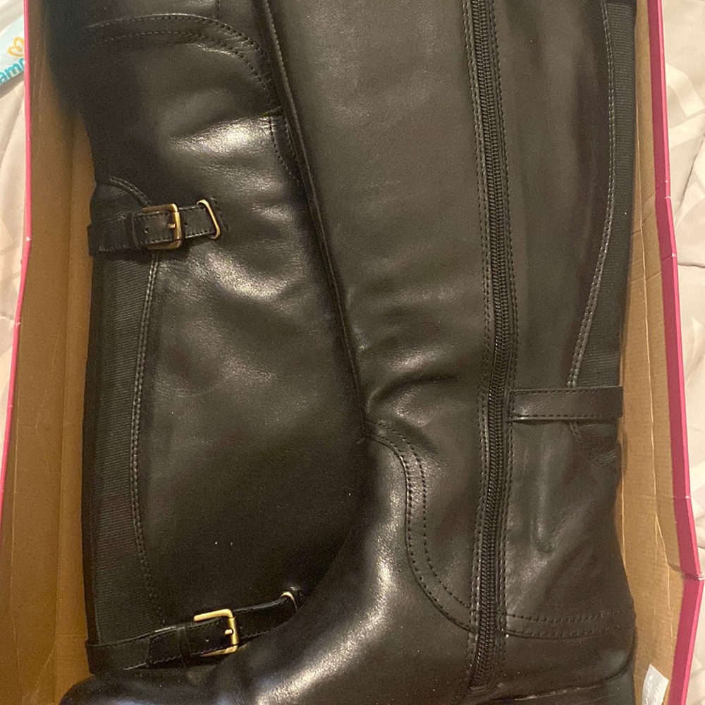 Tall, black wide shaft boot.